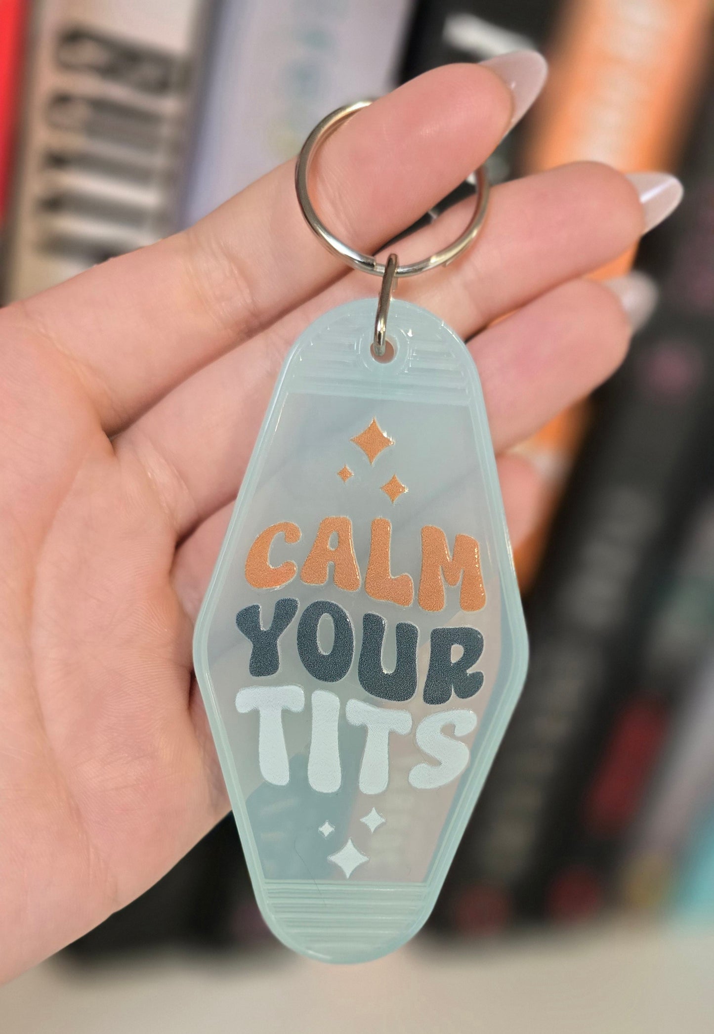 Calm Your Tits Motel Keychain